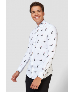 White Christmas shirt with penguins with a Santa hat worn by man - close up